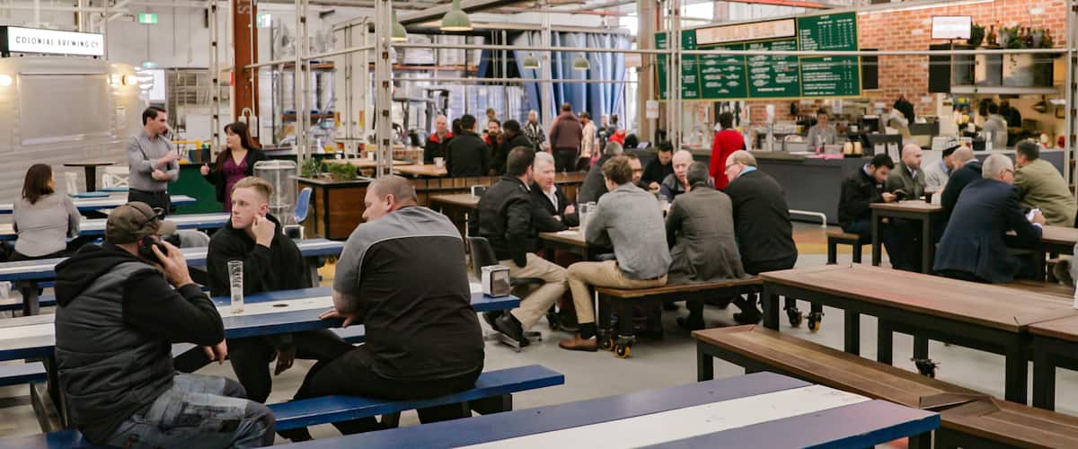 Colonial Brewing Co. featuring interior views and a bar as well as a small group of people