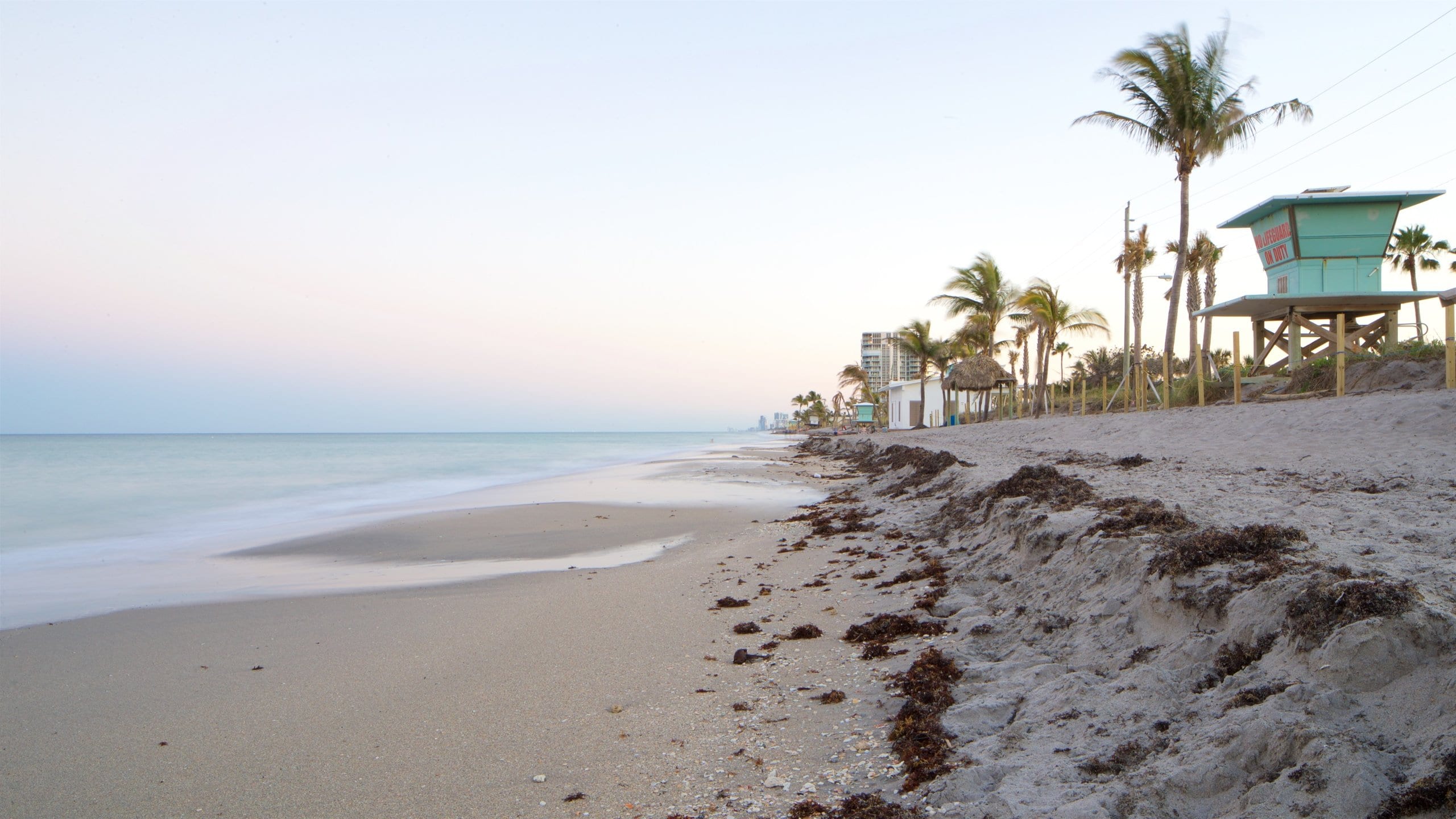 Dania Beach showing a sunset, a beach and general coastal views