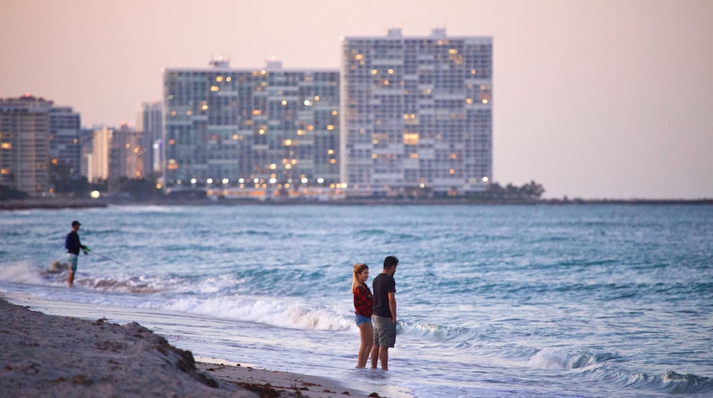 Dania Beach which includes general coastal views, a sunset and a beach