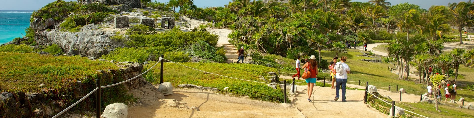 Tulum National Park featuring hiking or walking and building ruins