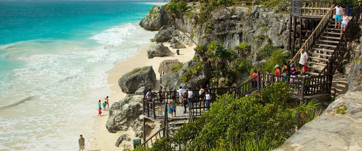 Tulum Mayan Ruins featuring tropical scenes and rocky coastline