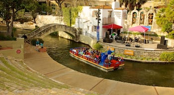 Downtown - Riverwalk showing a river or creek, a bridge and boating