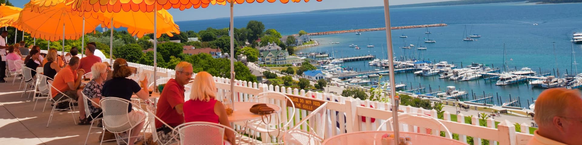 Mackinac Island showing general coastal views, outdoor eating and a marina