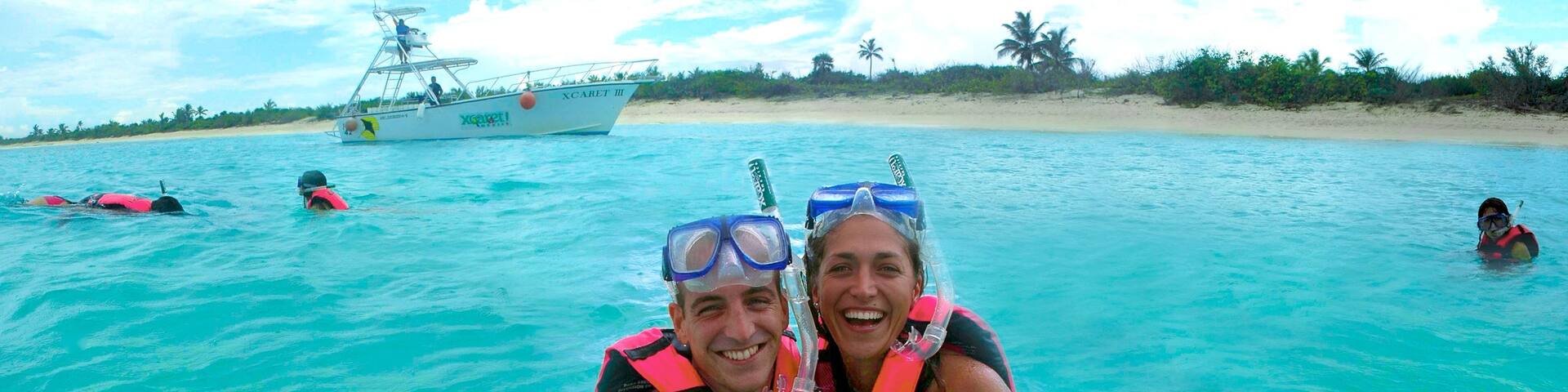 Xcaret Eco Theme Park featuring snorkeling, a sandy beach and tropical scenes