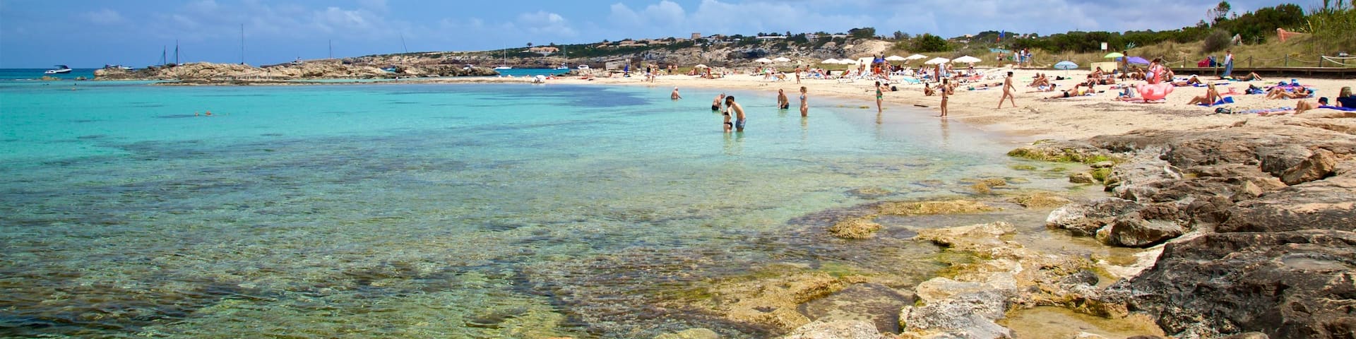 Es Pujols Beach which includes rocky coastline, general coastal views and swimming