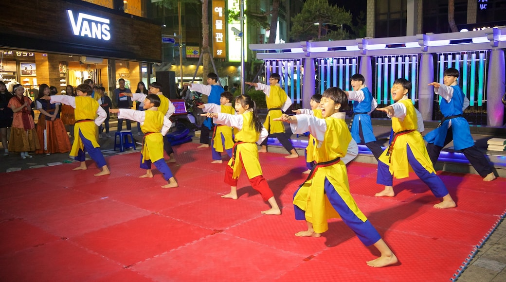 Andong showing performance art as well as a small group of people