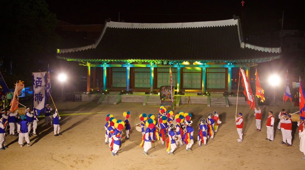 Andong showing night scenes and performance art as well as a small group of people