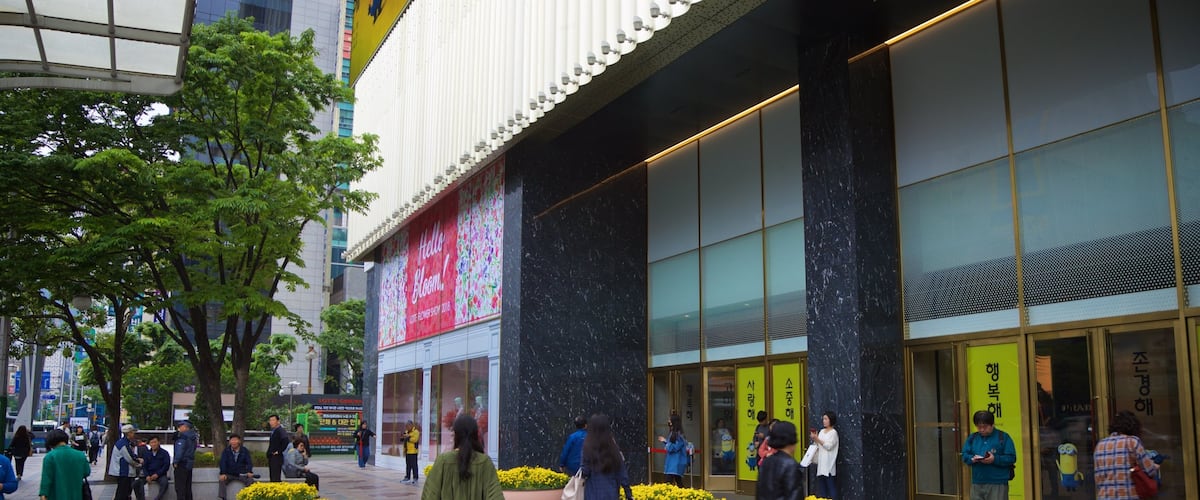 Lotte Department Store featuring street scenes and flowers as well as a small group of people