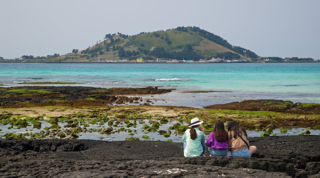 Hyeopjae Beach which includes general coastal views as well as a small group of people