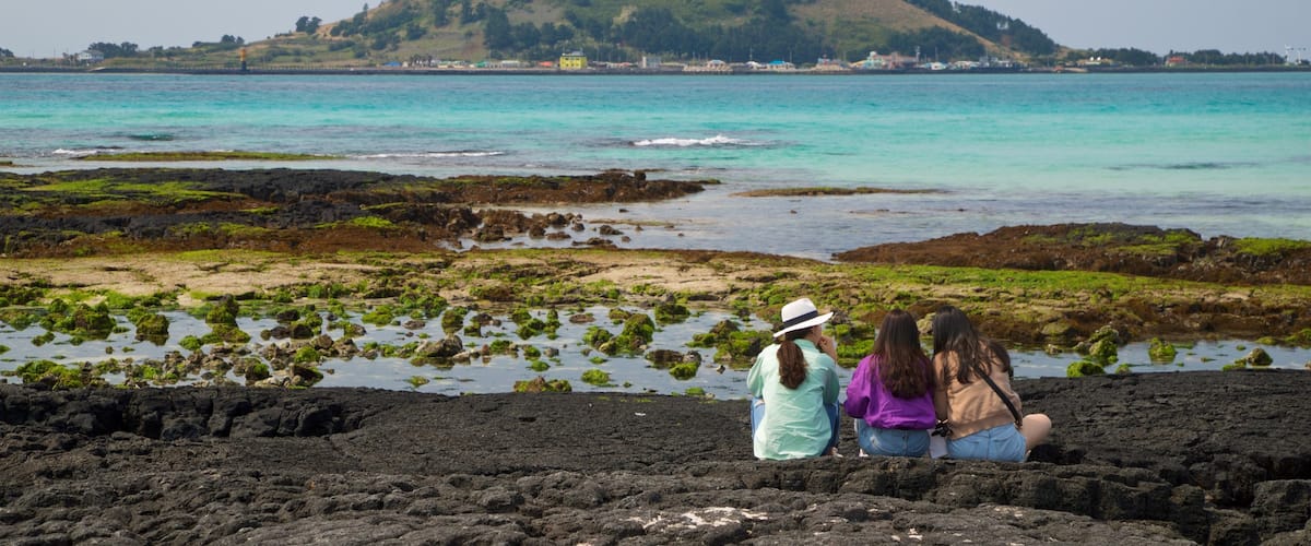 Hyeopjae Beach which includes general coastal views as well as a small group of people