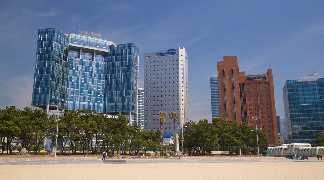 Haeundae Beach showing a beach, a city and a coastal town