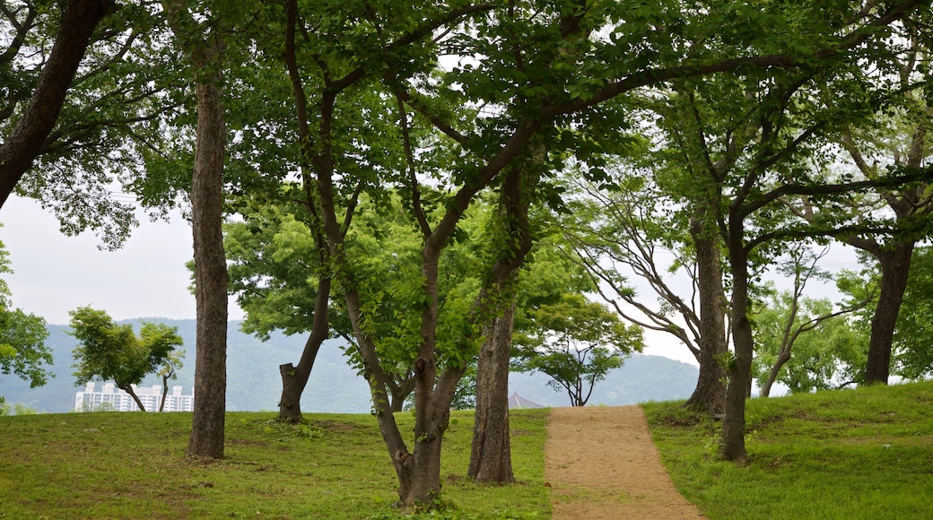 Gyeongju Donggung Palace and Wolji Pond featuring a garden