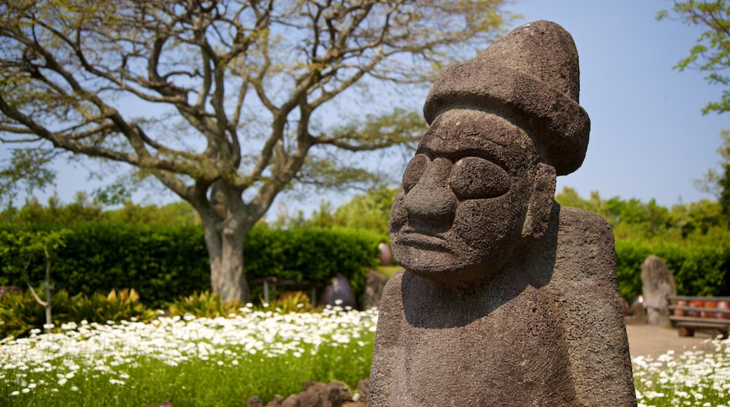 Jeju Folk Village Museum which includes a statue or sculpture, wildflowers and heritage elements