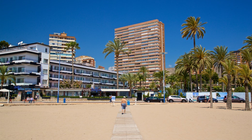 Poniente Beach showing a beach, a coastal town and general coastal views