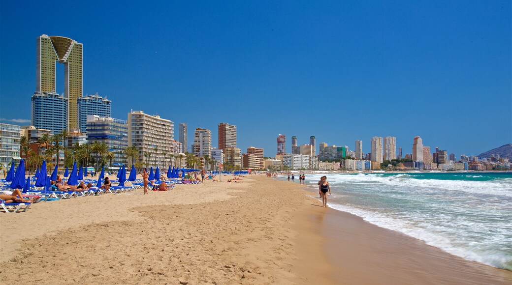 Poniente Beach featuring a coastal town, general coastal views and a sandy beach