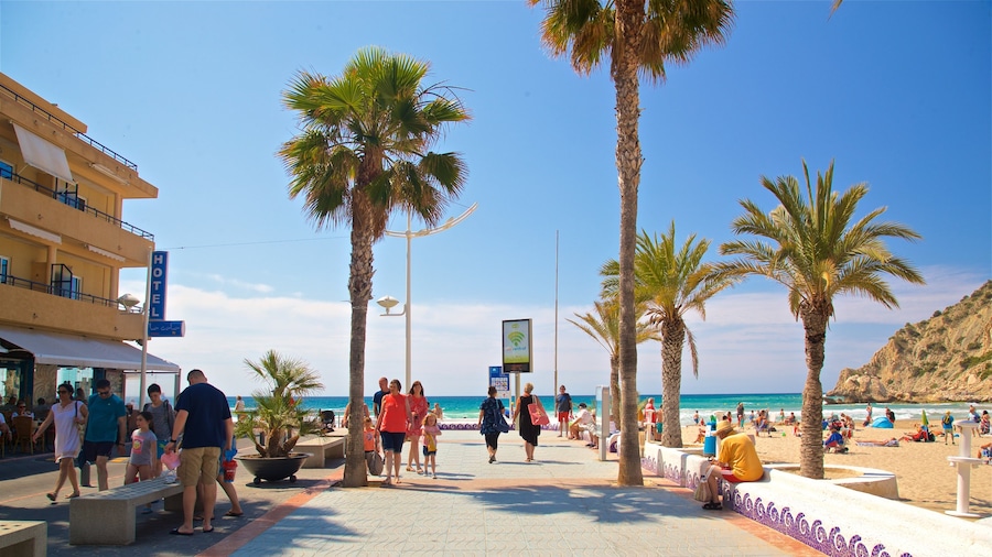 La Cala Beach featuring a coastal town as well as a couple