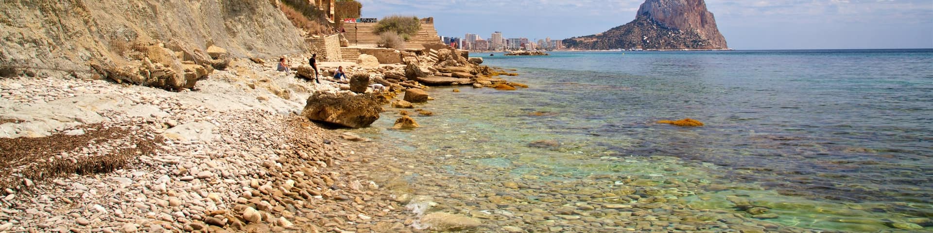 Cala La Manzanera featuring rugged coastline, general coastal views and a pebble beach