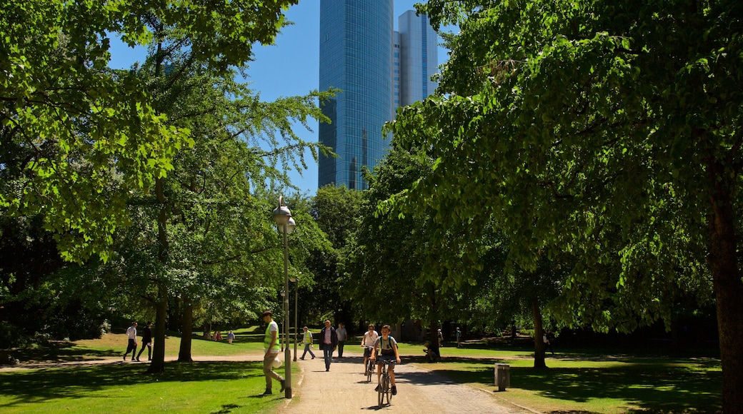 Deutsche Bank Twin Towers which includes cycling, a high rise building and a garden