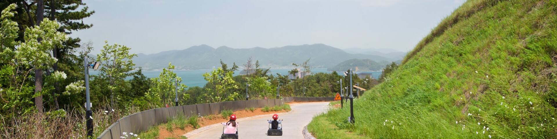 Skyline Luge Tongyeong as well as a small group of people