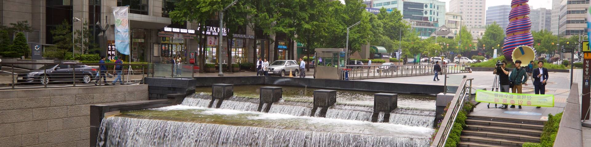 Cheonggye Plaza which includes a city and a river or creek