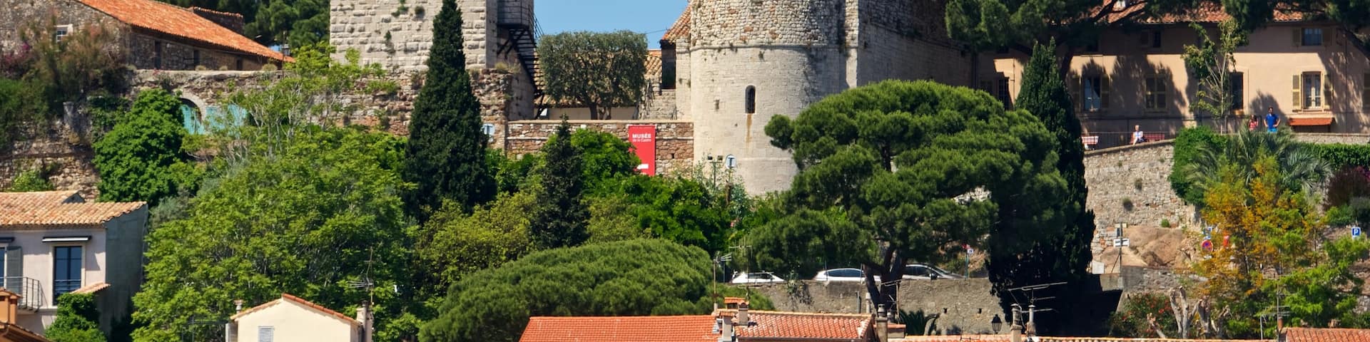 Notre Dame d\'Esperance Church showing heritage elements, a small town or village and landscape views