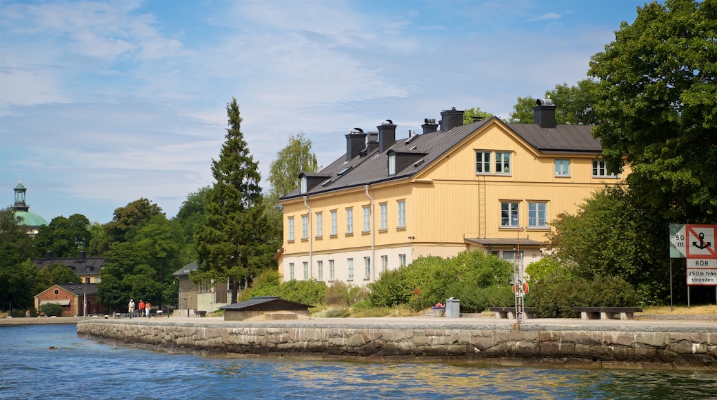 Skeppsholmen showing a small town or village and a lake or waterhole