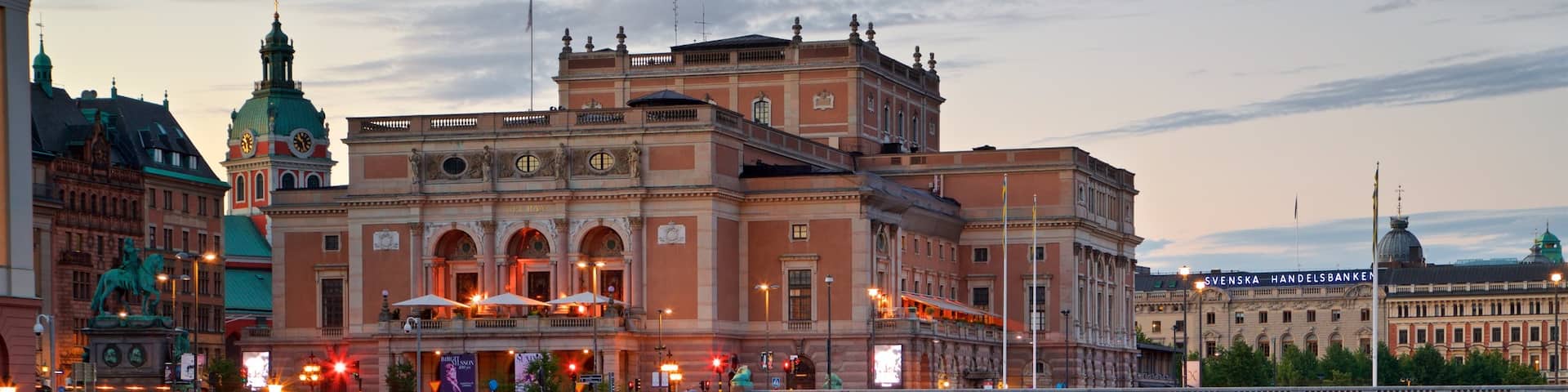 Royal Swedish Opera featuring a bridge, a river or creek and a sunset