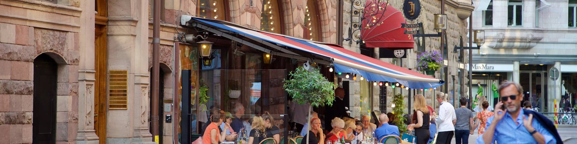 Norrmalm showing outdoor eating, street scenes and a city