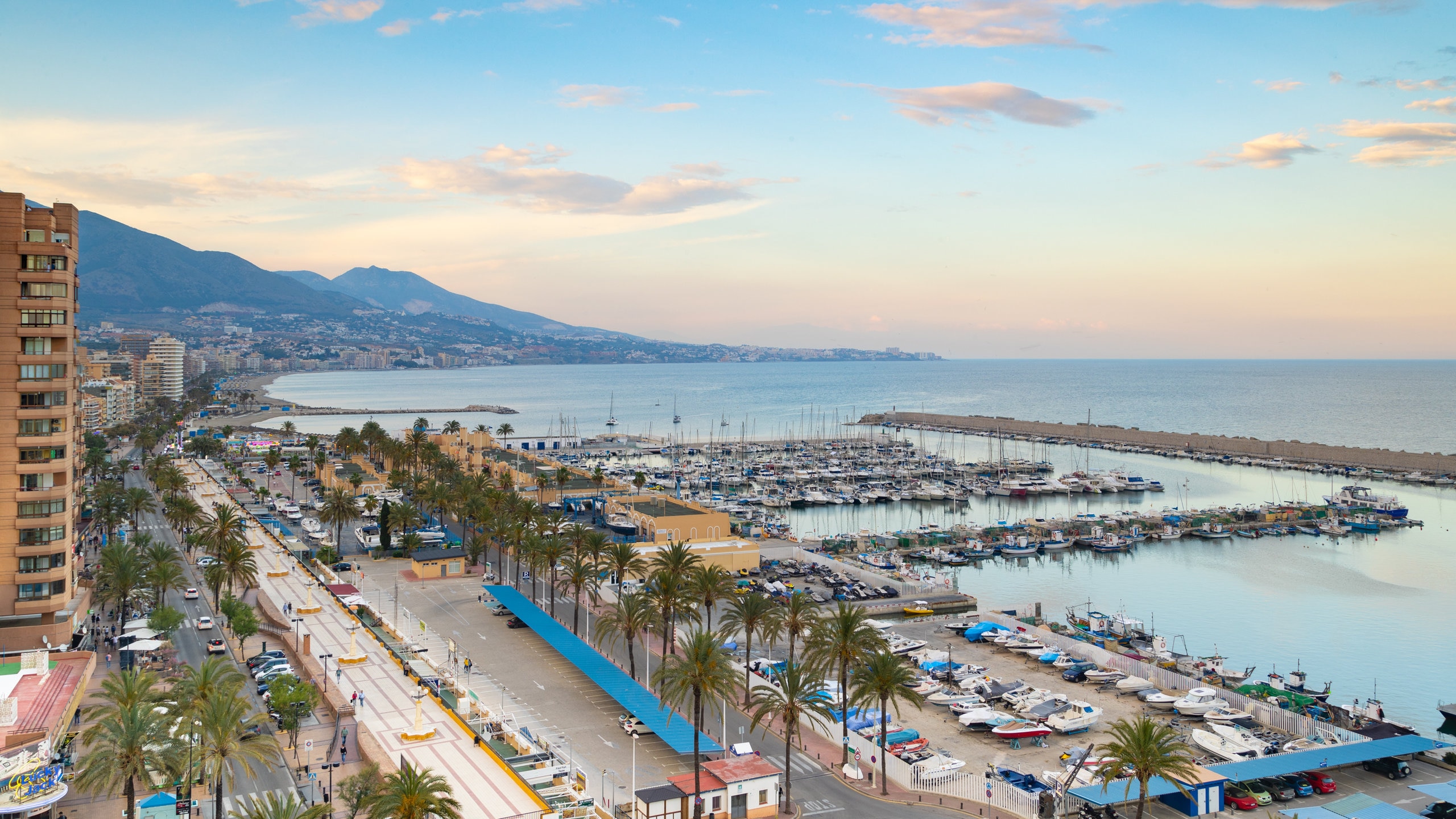 Fuengirola which includes a sunset, a coastal town and landscape views