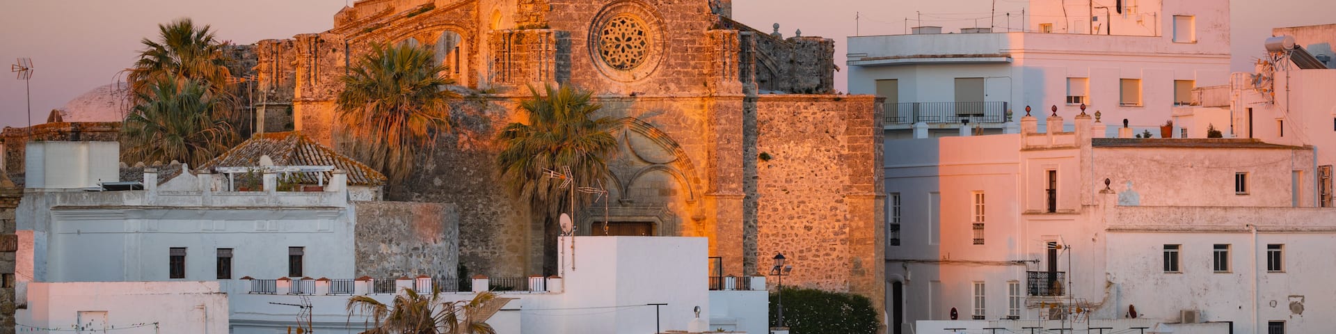 Vejer de la Frontera showing heritage architecture, landscape views and a sunset