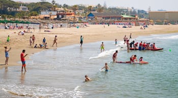 Cabopino Beach which includes a sandy beach, general coastal views and swimming