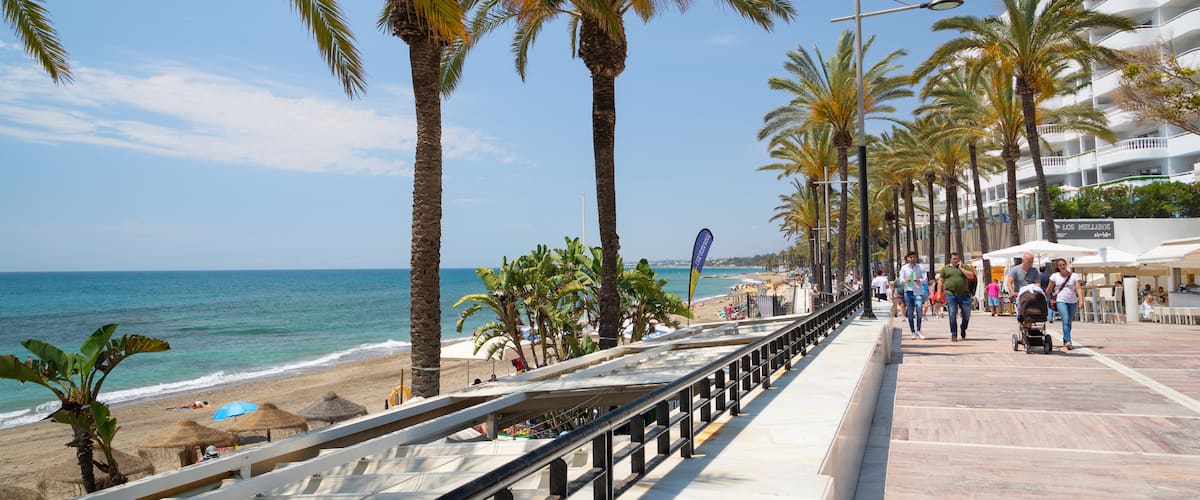 Marbella Seafront Promenade which includes general coastal views and a coastal town