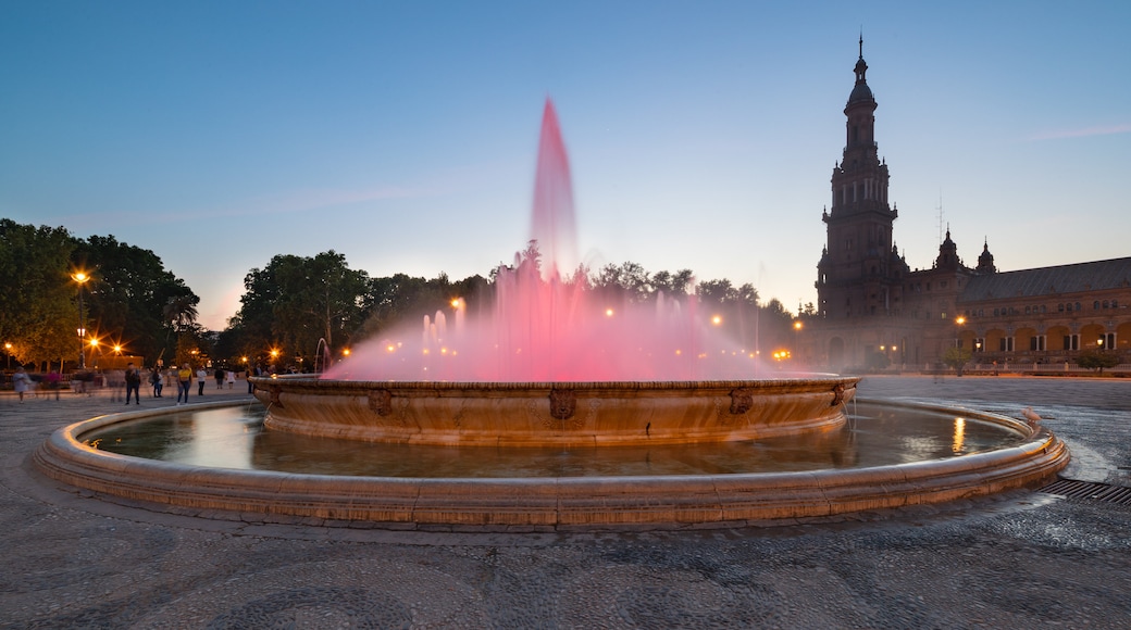 Plaza de Espana featuring a fountain, night scenes and a sunset