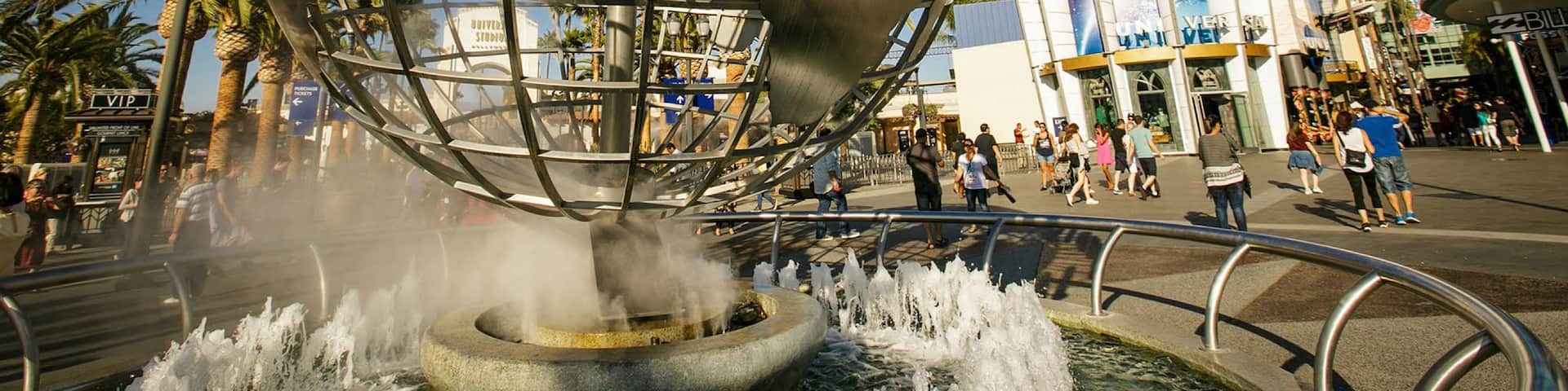 Universal Studios which includes rides, signage and a fountain