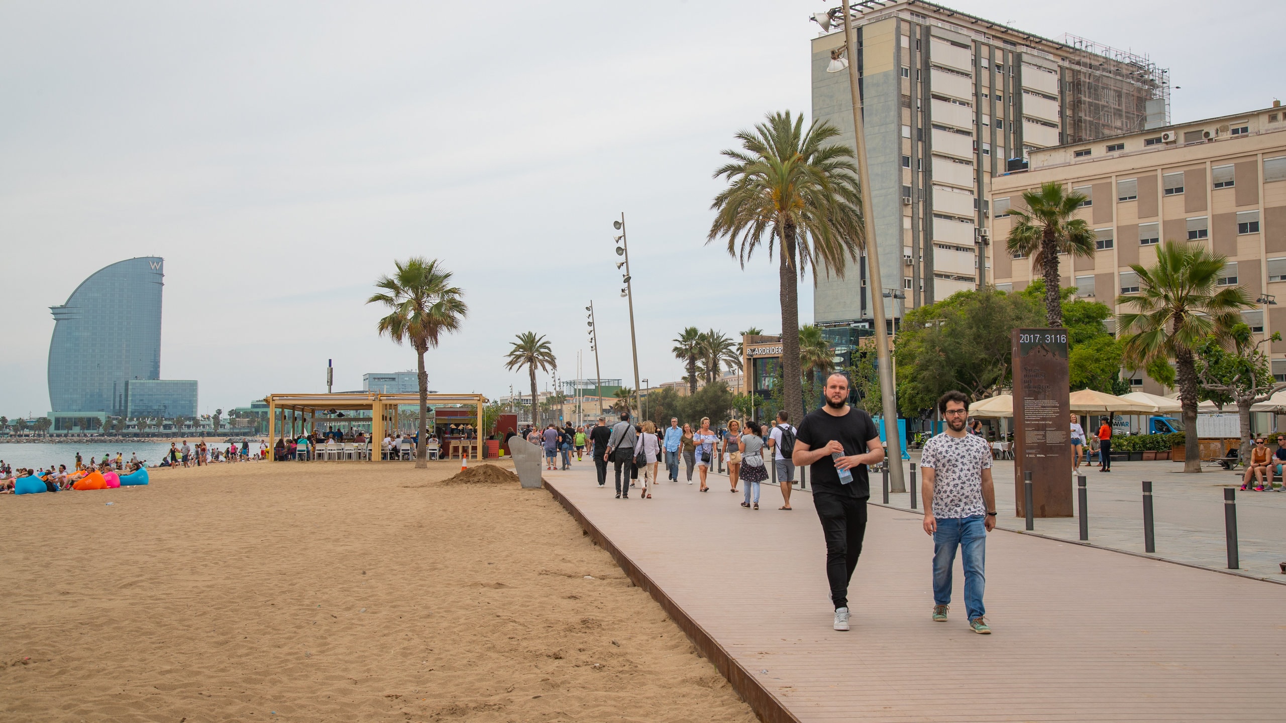 Barceloneta Beach which includes general coastal views, a beach and a coastal town