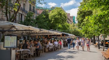 Eixample showing street scenes and outdoor eating as well as a small group of people