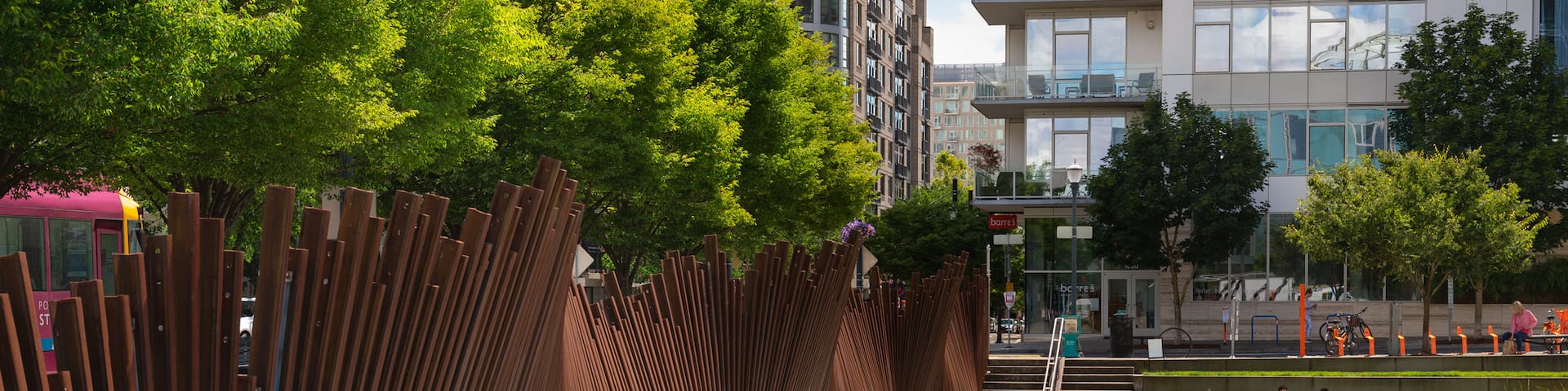 Pearl District showing a pond and a garden as well as an individual femail