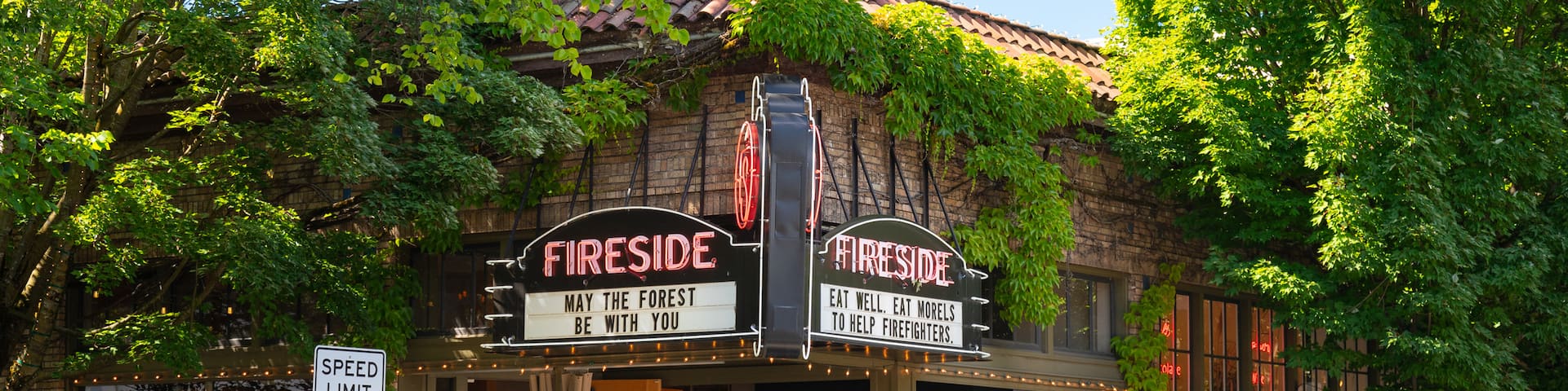 Nob Hill showing signage and outdoor eating as well as a small group of people