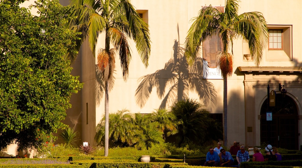 Alcazar Garden which includes a park as well as a small group of people