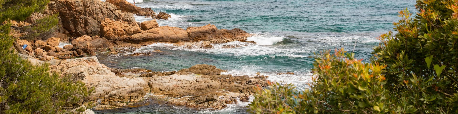 Cala Boadella Beach featuring rocky coastline and general coastal views
