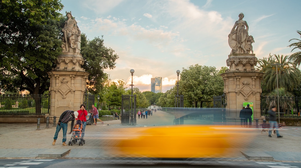 Parc de la Ciutadella which includes a sunset and a park as well as a family