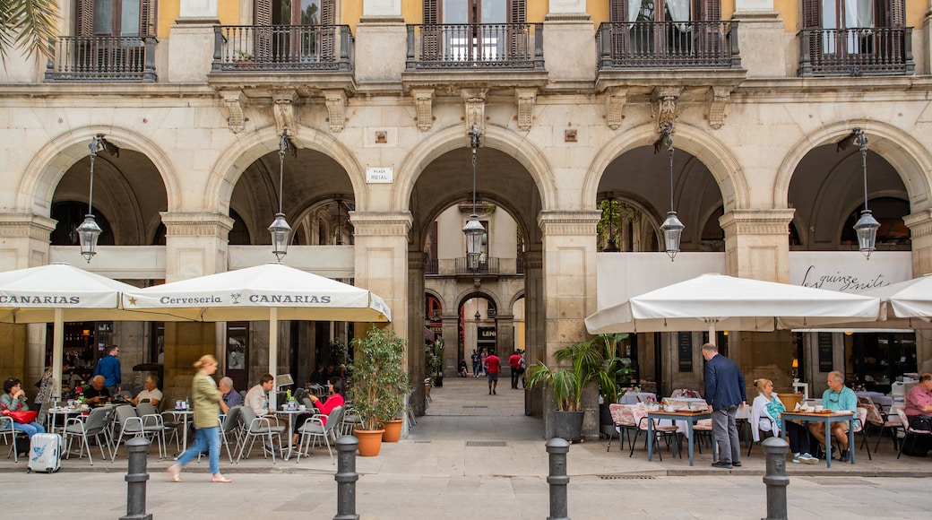 Placa Reial featuring outdoor eating as well as a small group of people