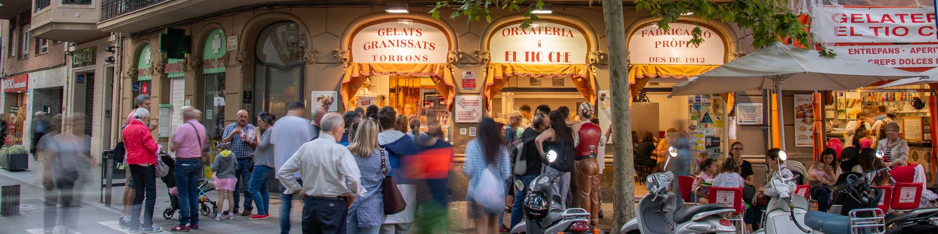 Poblenou showing street scenes as well as a small group of people
