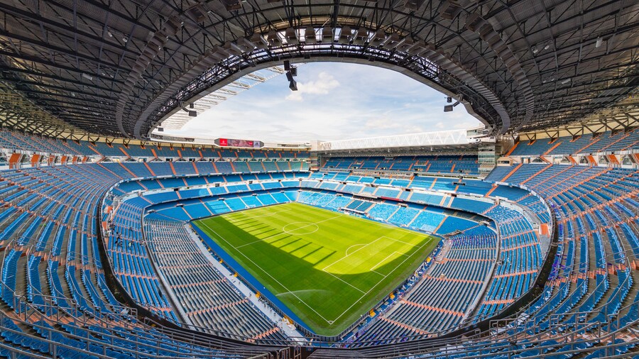 Interior view of Santiago Bernabéu Stadium in Madrid, showcasing its iconic design.