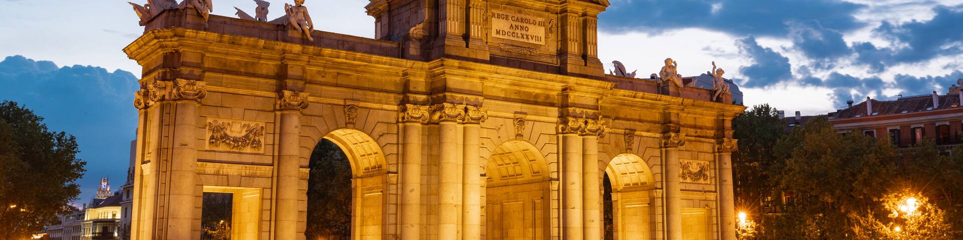 Puerta de Alcala featuring night scenes and heritage architecture