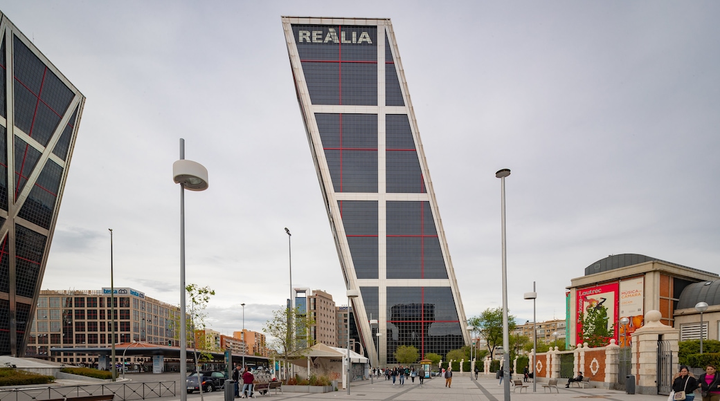 Plaza de Castilla featuring signage and modern architecture