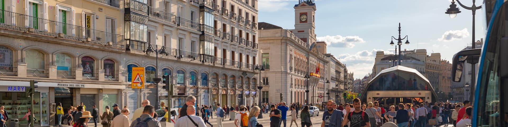 Puerta del Sol showing street scenes, a sunset and a city