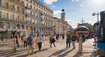 Puerta del Sol showing street scenes, a sunset and a city