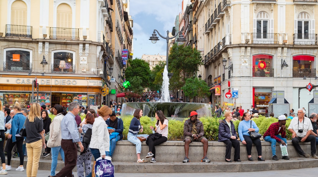 Puerta del Sol which includes a fountain, a city and street scenes