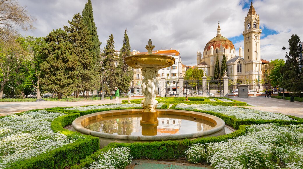 Church of San Manuel y San Benito which includes a garden, flowers and heritage architecture